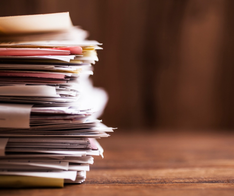large-stack-of-paperwork-files-on-office-desk-with-copyspace-picture-id655072294.jpg
